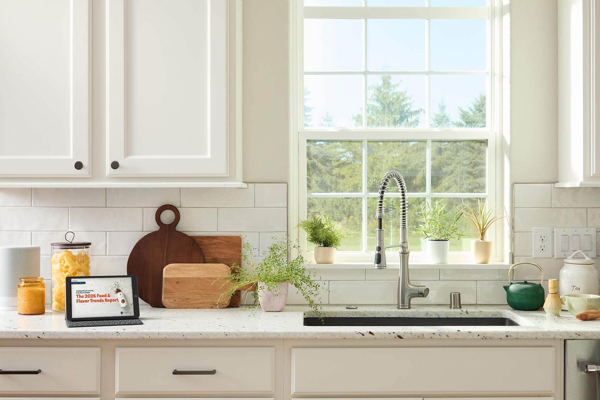 Photo of an iPad on a kitchen counter, viewing the MorganMyers 2026 Food & Flavor Trends Report
