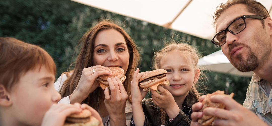family eating burgers